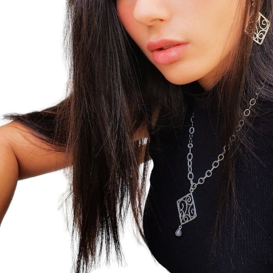 Long Silver Necklace with Ornamental Pendant and Pearl